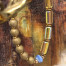 Bracelet élastique bohème chic composé de perles en verre de Bohême cylindriques et rondes jaune or. Bracelet stretch de créateur.